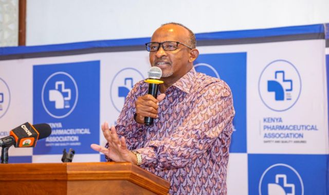 A man speaks into a microphone at a Kenyan pharmaceutical industry event
