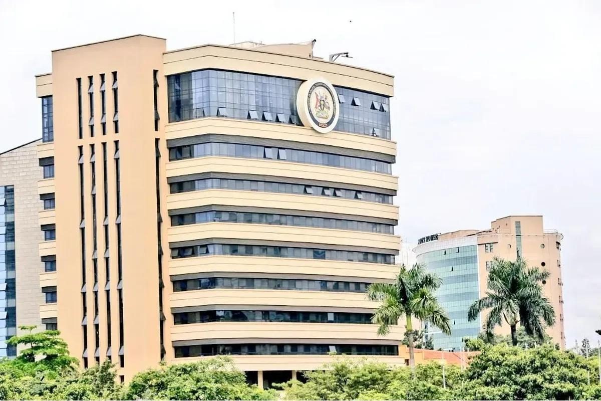 A multi-storey office building beside palm trees